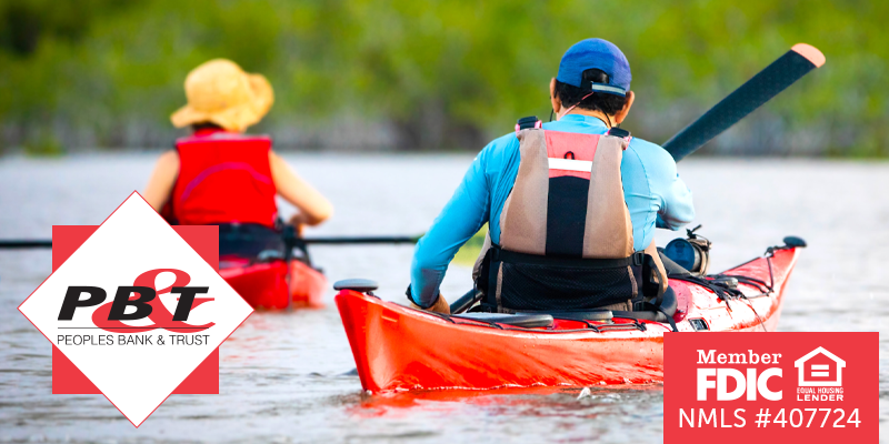 Two individuals kayaking out on the water